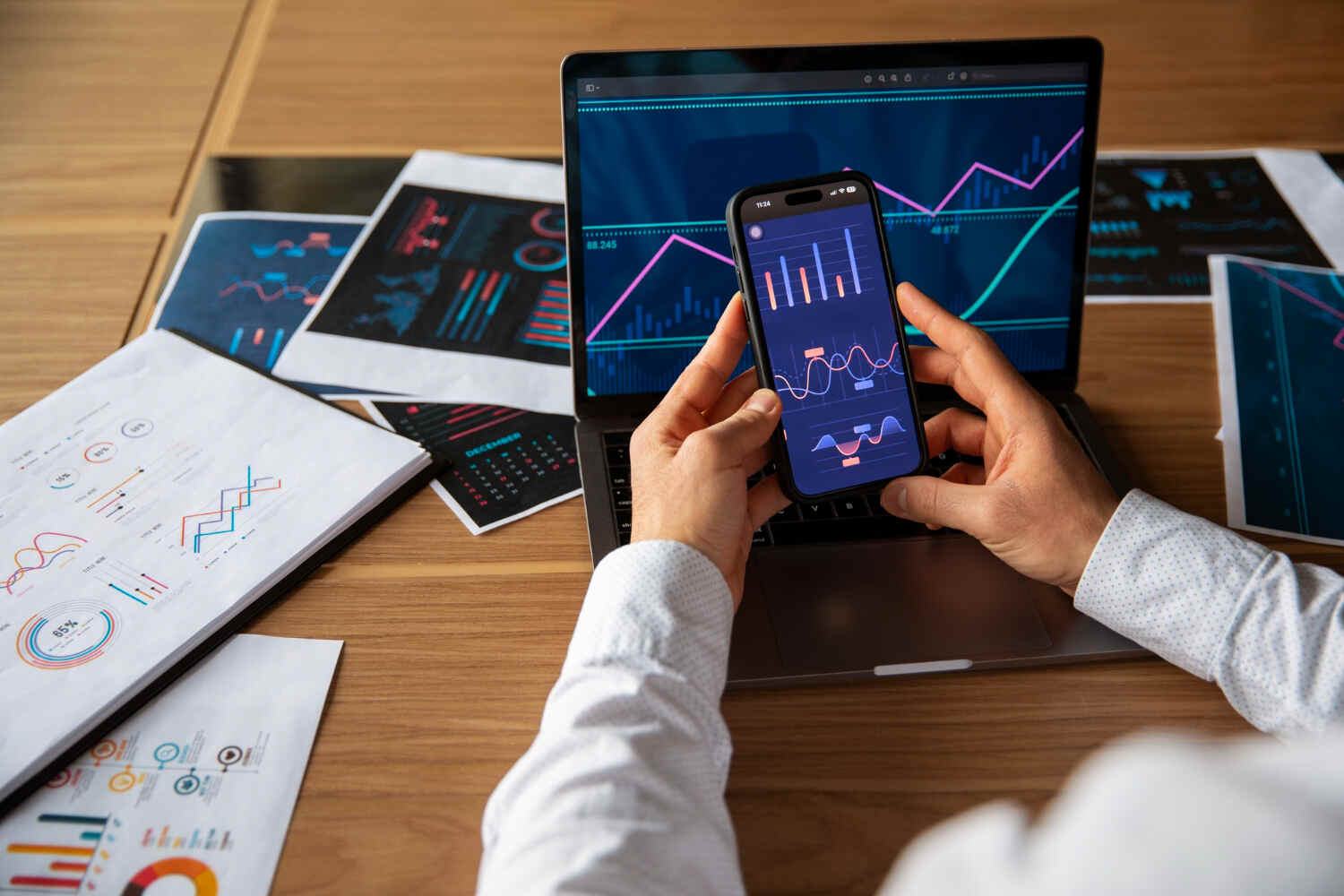 Mobile app analytics dashboard displaying performance metrics, user data, and business growth charts on smartphone and laptop screens.